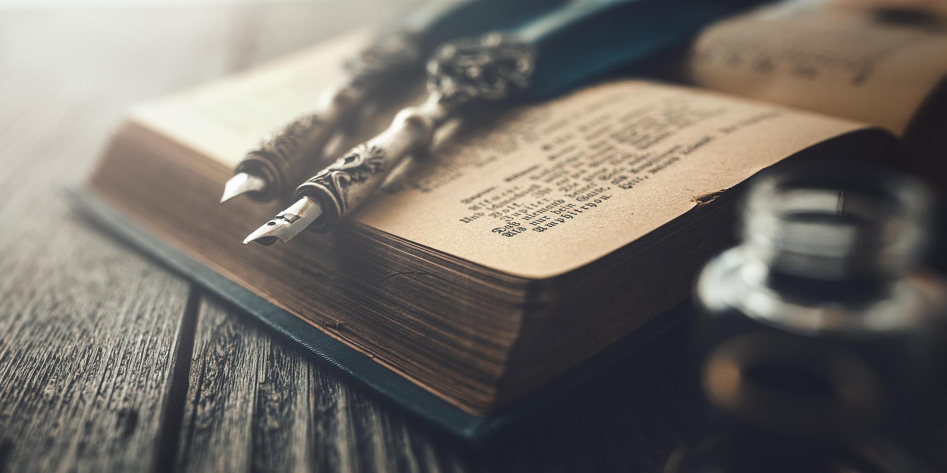 book with calligraphy pens and ink